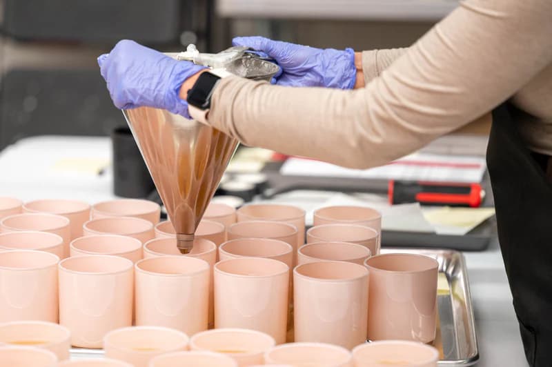 Pouring a Wick of Hope candle by hand