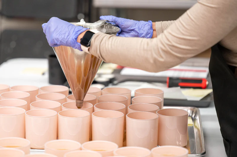 Pouring a Wick of Hope candle by hand